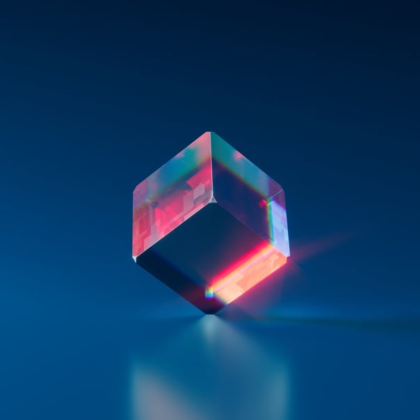 crystal cube with rainbow light refracting through it